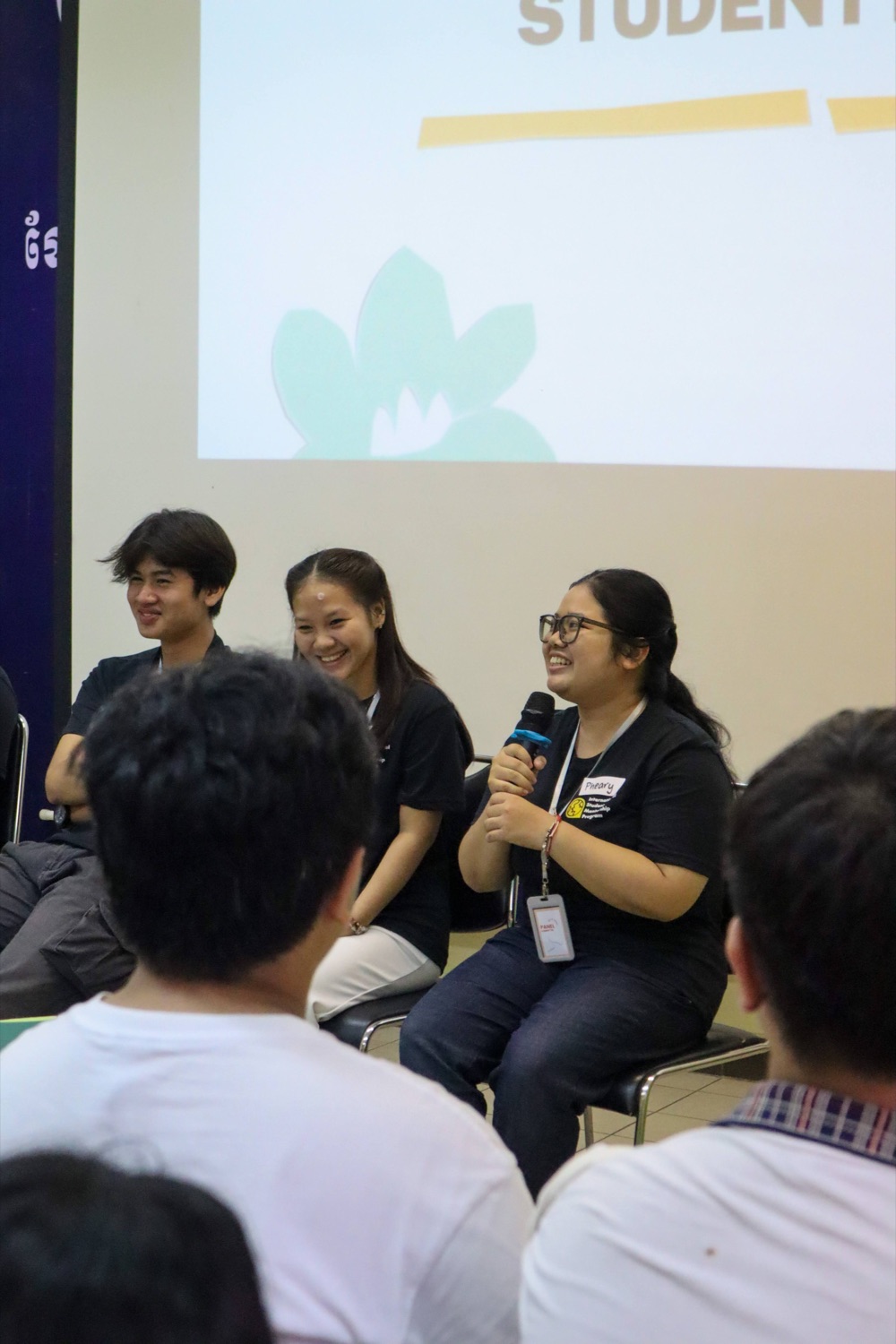 Ambassadors speaking on a student panel to an audience.