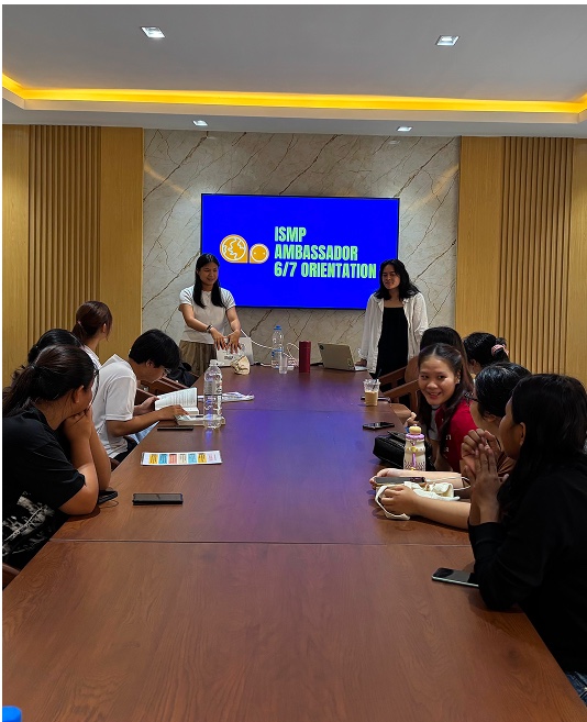 Ambassadors seated around a boardroom table at the ISMP Ambassador orientation.